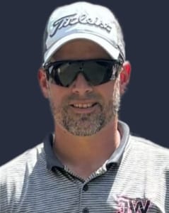 Josh Wallace, co-owner of JW Plumbing Pros, wearing a Titleist cap and sunglasses, smiling in a professional polo shirt, embodying commitment to quality plumbing services.